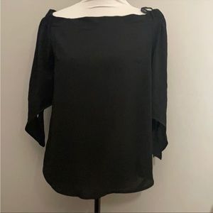 Black off shoulder blouse.